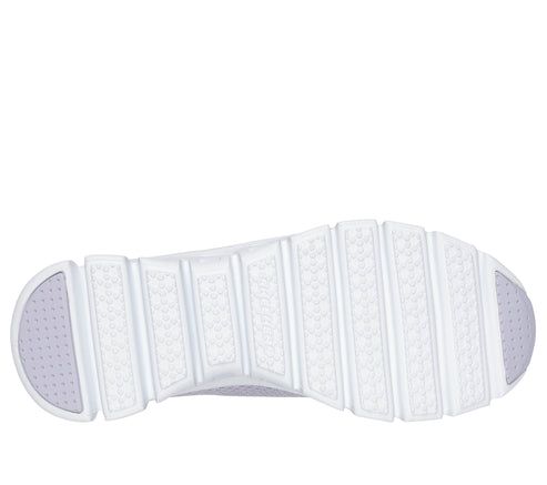 White shoe outsole with a ribbed pattern.