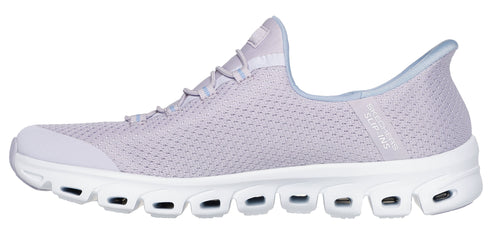 Lavender mesh slip-on shoe with a white sole featuring a series of oval cutouts.