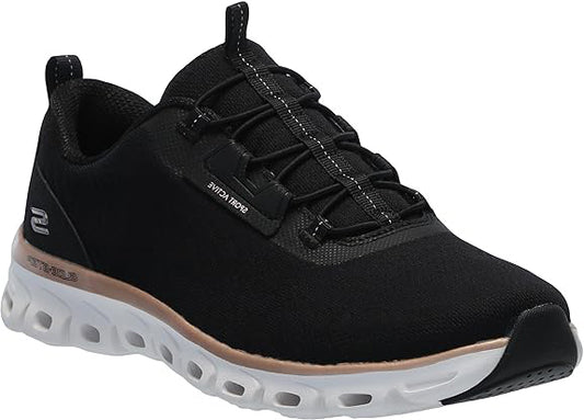 Black sneaker with a white sole and elastic laces.