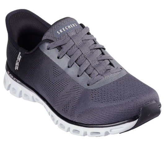 Gray athletic shoe with white sole and gray laces, logo on tongue and side.