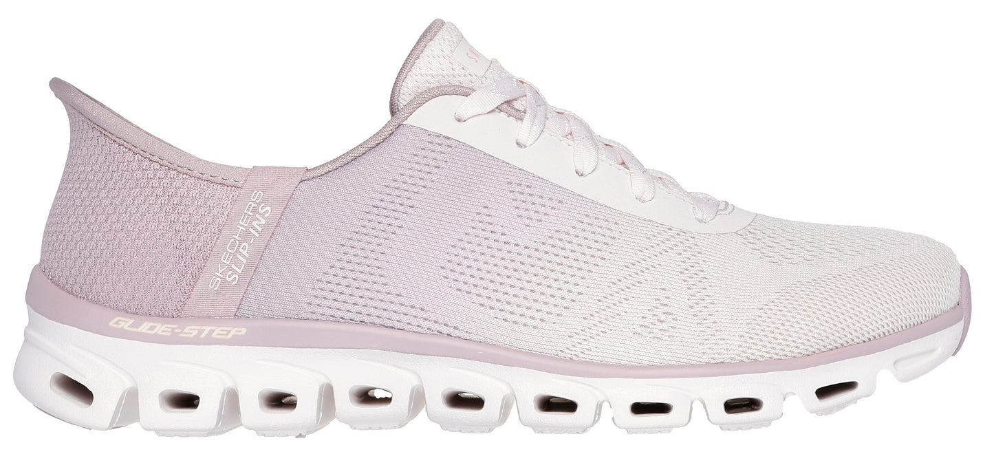A lavender and white athletic shoe with a textured upper and a unique sole with cutouts.