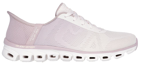 A lavender and white athletic shoe with a textured upper and a unique sole with cutouts.