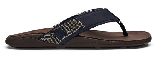 A dark brown flip-flop with a blue and white patterned strap.