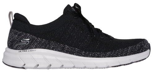 A black and white athletic shoe with a thick white sole.