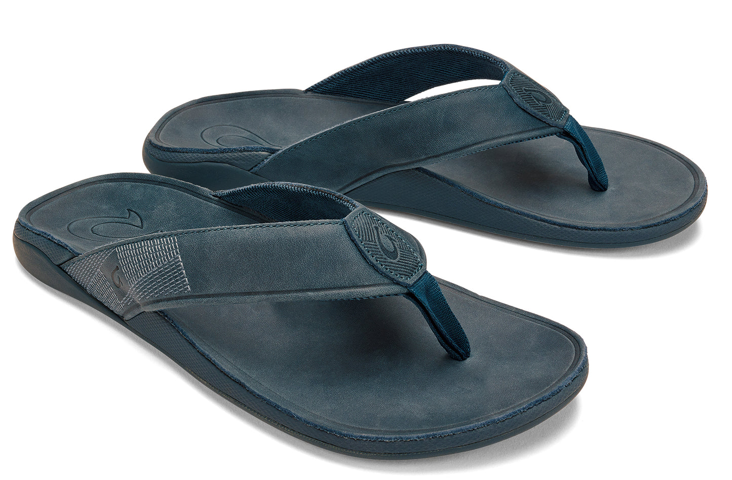 Pair of leather flip-flops with toe posts.