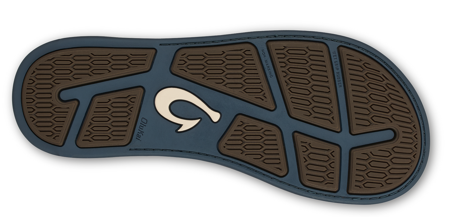 The sole of a shoe with a brown hexagonal pattern.