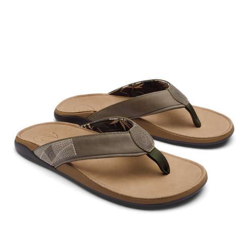 Pair of flip-flops with green leather straps, tan footbeds, and dark soles.