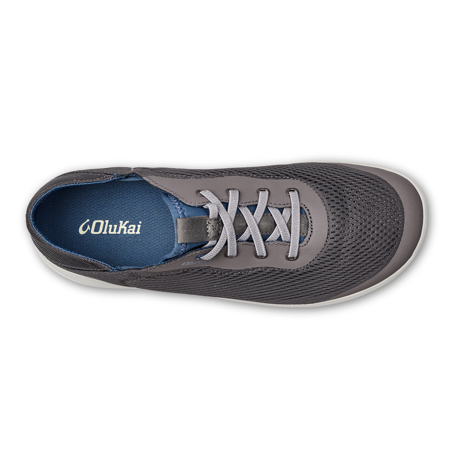 Overhead view of a gray sneaker with gray laces and a white sole. The insole is blue with white text that reads 'Olukai'.