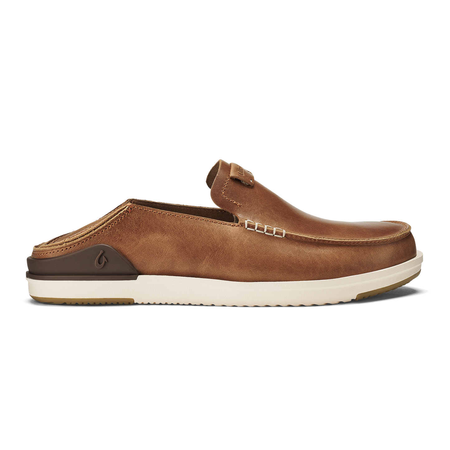 A tan brown leather slip-on mule shoe with a collapsible heel, visible decorative side stitching, and a thick, white ridged rubber sole featuring a dark brown heel accent with an embossed logo.
