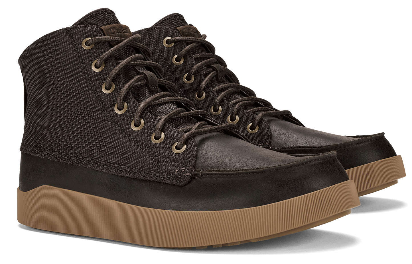 Ankle height boot with brown leather toe and black canvas top on brown sole.