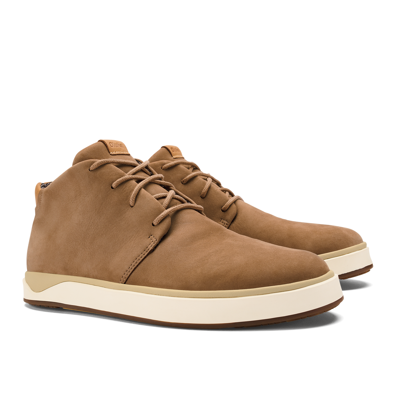 A pair of tan suede chukka-style sneakers with white rubber soles and tonal laces.