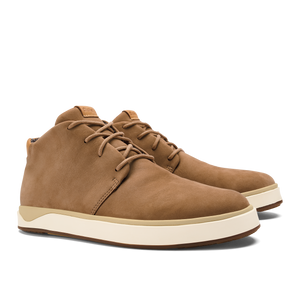 A pair of tan suede chukka-style sneakers with white rubber soles and tonal laces.