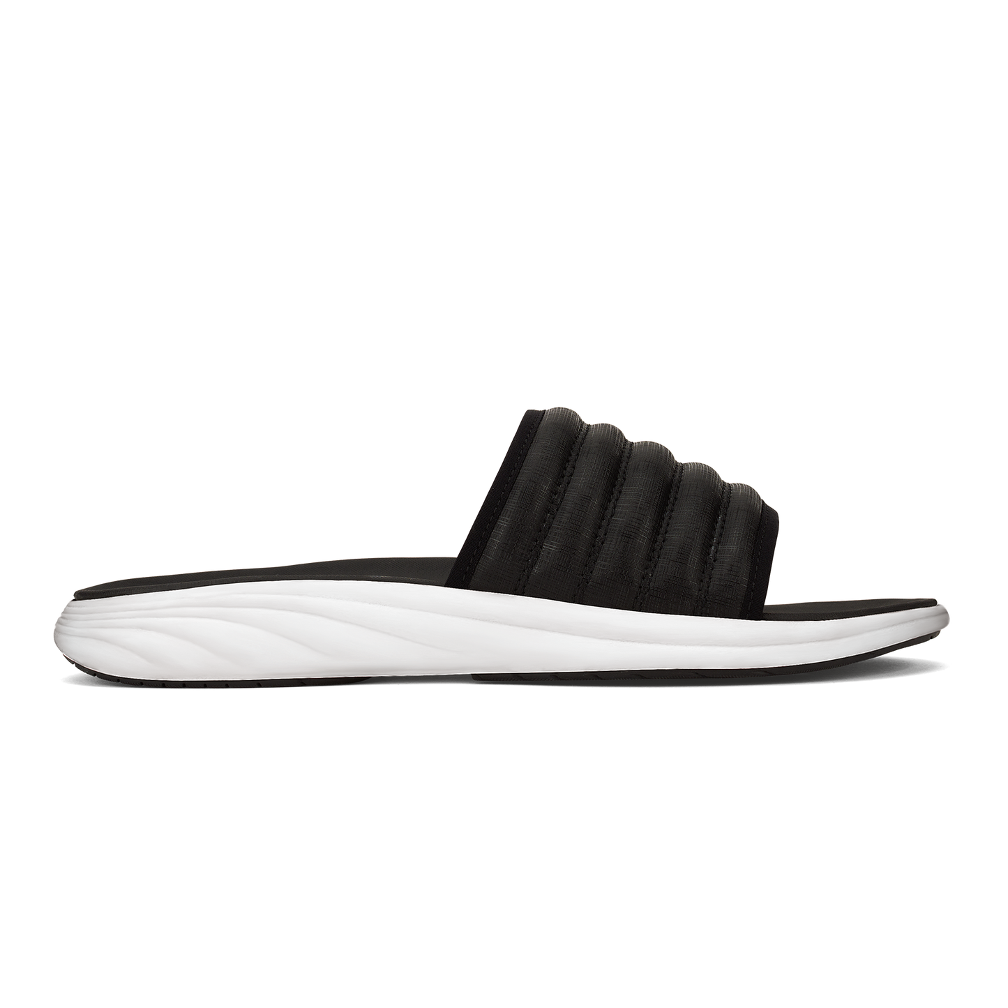Black slide sandal with a ribbed upper and white sole.