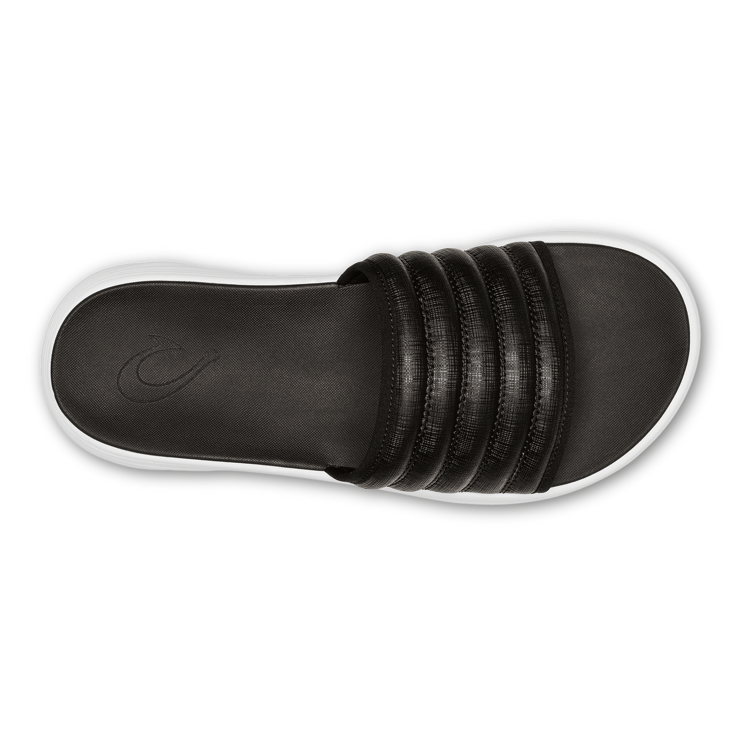 Overhead view of black slide sandal with white sole.