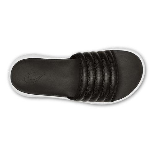Overhead view of black slide sandal with white sole.