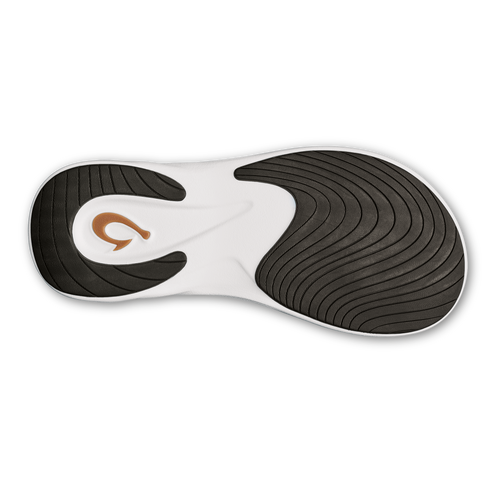 shoe sole with brown logo and black lines for traction