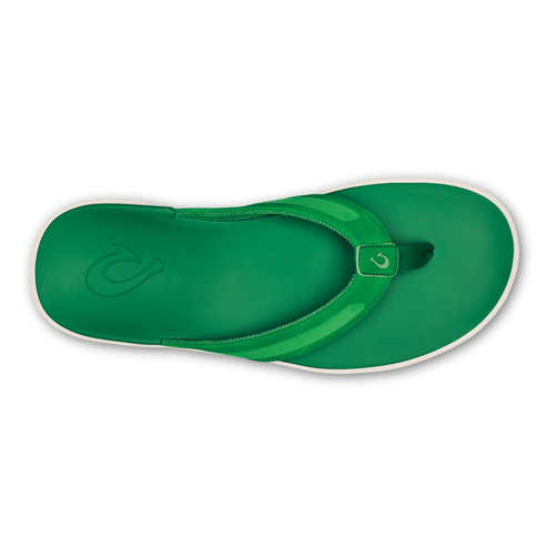 A bright green flip-flop sandal viewed from directly above, featuring a glossy strap with a small logo and a matching green footbed with an embossed logo, accented by a white midsole and black outsole.