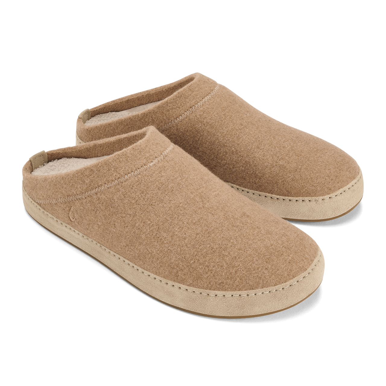 A pair of tan, slip-on felt slippers with a light beige, smooth rubber-like trim around the sole and a plush lining visible at the heel.