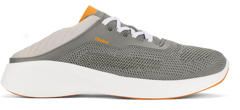 A gray slip-on sneaker with white laces, a white sole, and orange accents.