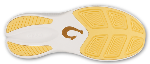 Bottom of a shoe with a tan logo in the middle and yellow treads.