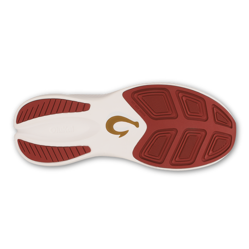 The bottom sole of a shoe, featuring a white base with a textured, deep red rubber tread pattern and a gold hook-shaped logo in the center.
