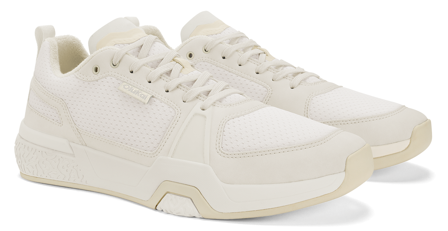 Beige sneakers with white laces and sole.