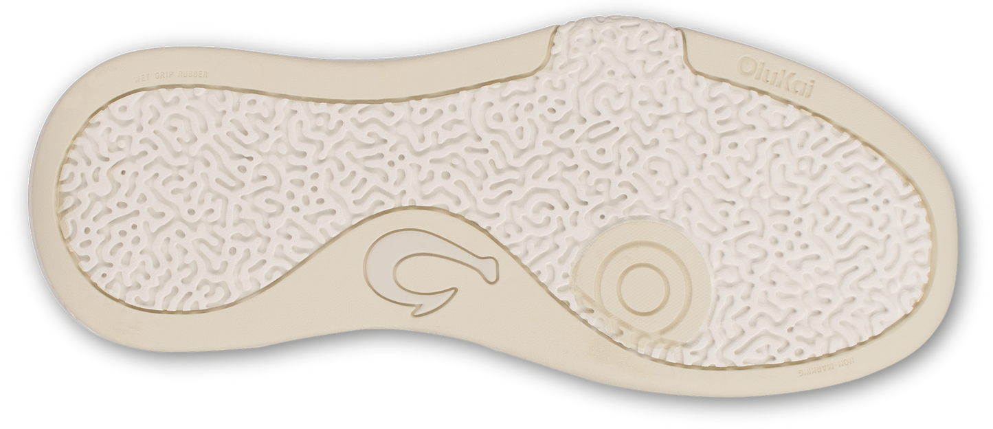 The sole of a shoe with a hook design and a circular design on the sole.