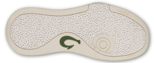 The sole of a sandal with a textured pattern and a green logo.
