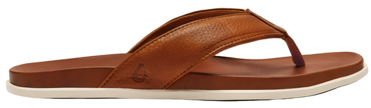 A brown leather flip-flop with a white sole.