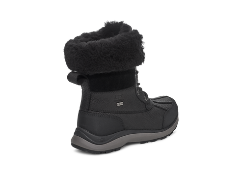 Black winter boot with fur trim.
