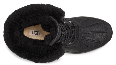Black UGG boot with black shearling lining and visible logo tag inside.