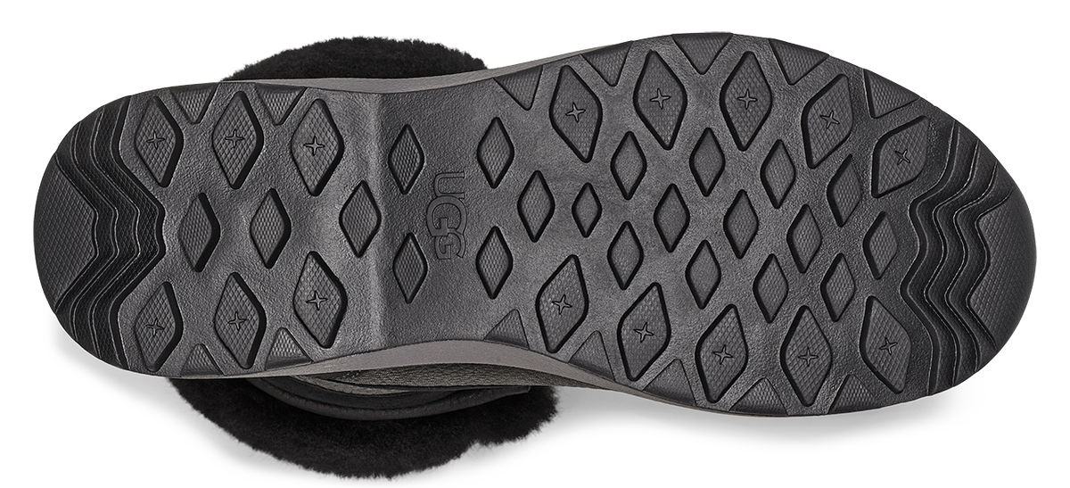 The outsole is black, with diamond shapes and stars inside the diamonds.