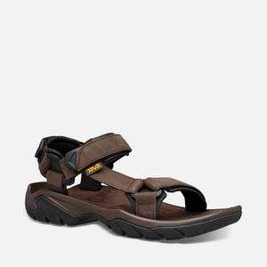 Brown sandal with black sole and adjustable straps.