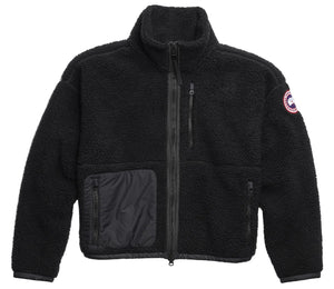 Black fleece jacket with full zip, chest zip pocket, side pocket, and circular patch on the sleeve.