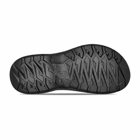 Black shoe sole with intricate geometric tread pattern.
