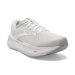 A white running shoe with laces and the word "BROOKS" in grey near the heel.
