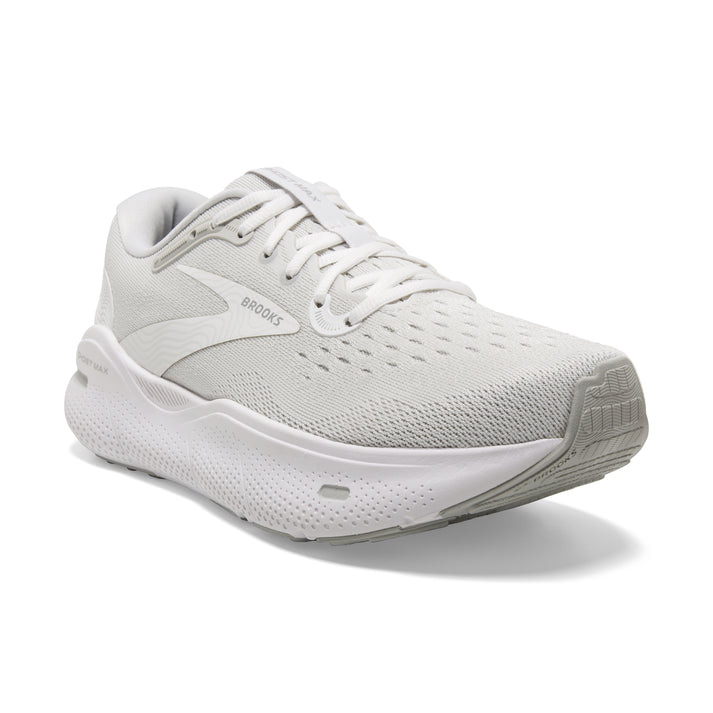 A white running shoe with laces and the word "BROOKS" in grey near the heel.