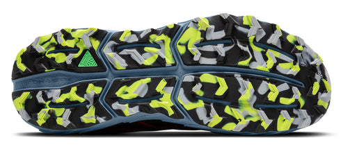 A shoe sole with a multicolored pattern of black, gray, and yellow.