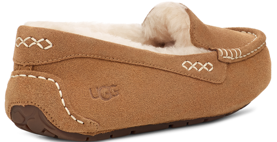 Tan suede slipper with white stitching detail and fur lining