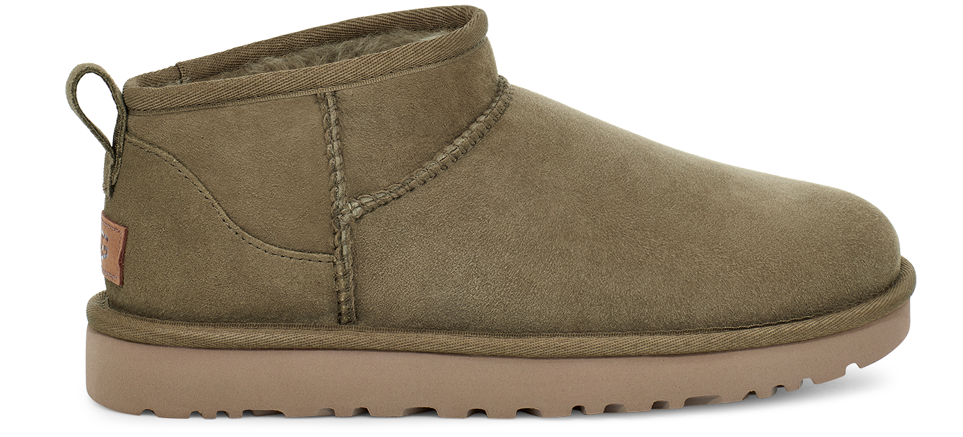 Ankle-high light brown UGG boot with a small loop pull-tab on the heel.