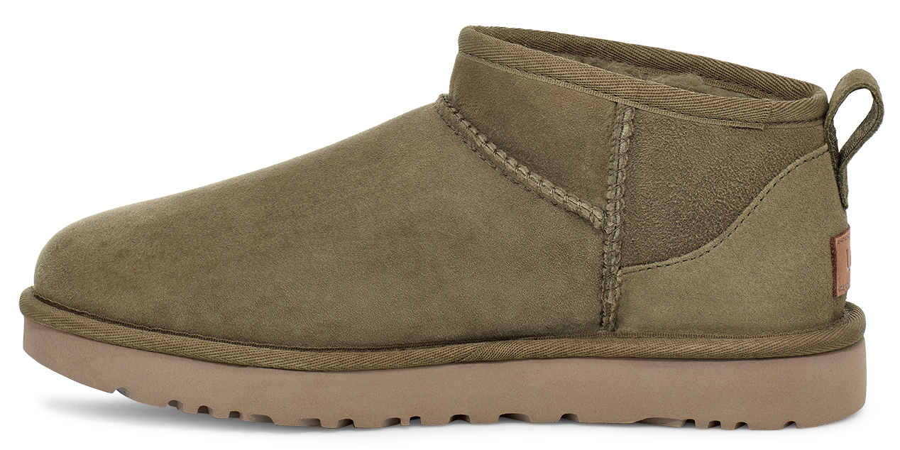 Olive-colored UGG ankle boot with tan sole and loop at the heel.