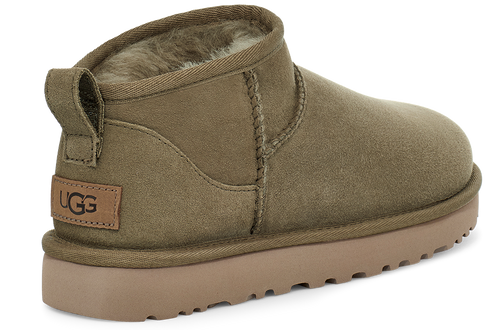 Olive green UGG boot with tan sole and heel pull.