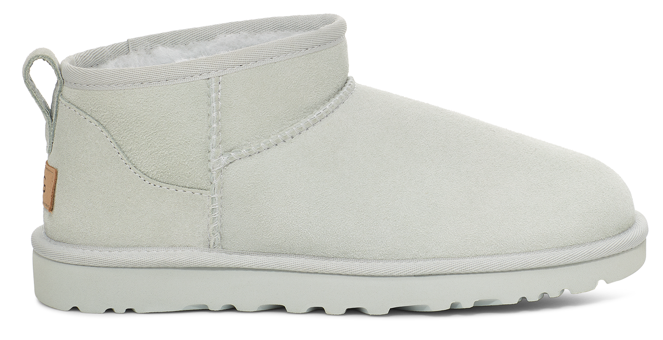 White, ankle-high boot with a rounded toe and pull tab at the back.