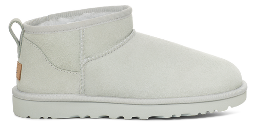 White, ankle-high boot with a rounded toe and pull tab at the back.