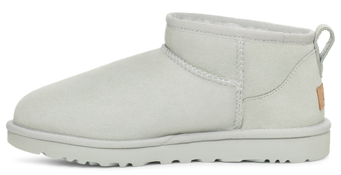 White ankle-high boot with a low heel, white sole and pull tab.