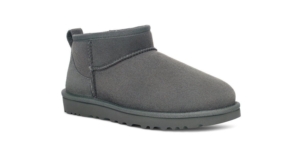 Gray suede ankle boot with dark gray sole.