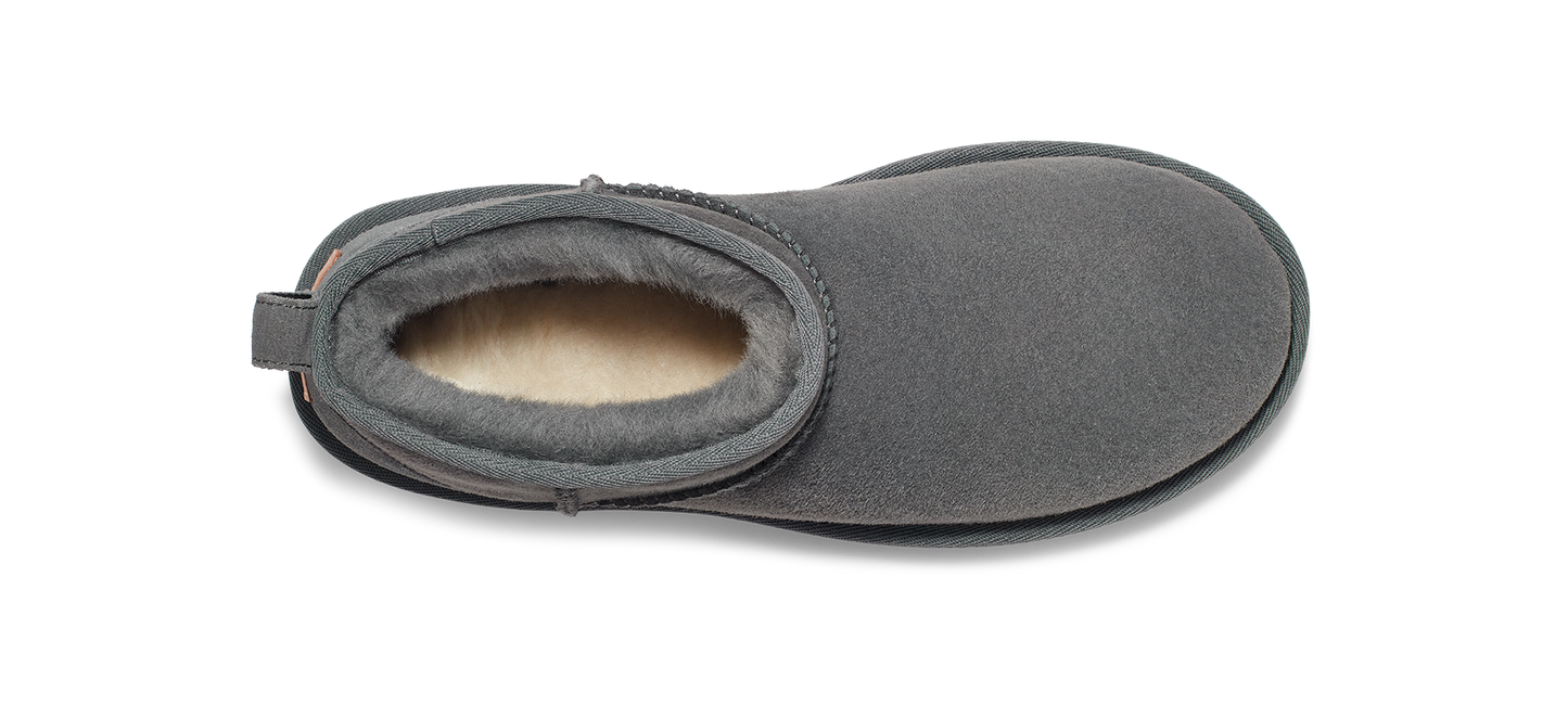 Gray suede slipper with fur lining.