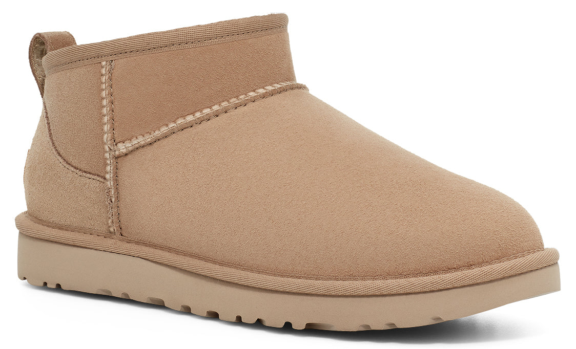 Tan suede ankle boot with a rounded toe.