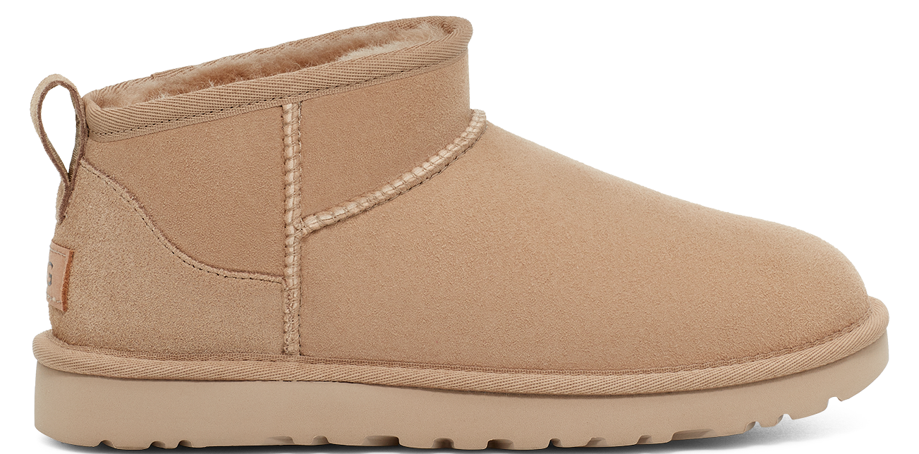 Tan colored, short, UGG boot with fluffy interior.
