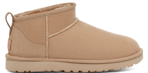 Tan colored, short, UGG boot with fluffy interior.